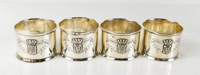 Lot 411 - A set of four silver napkin rings, engraved...