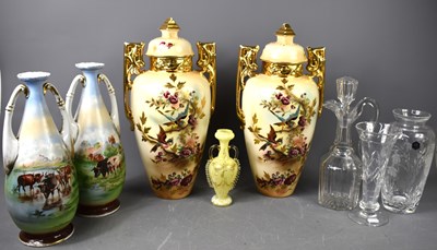 Lot 180 - A pair of Falcon Ware lidded vases decorated...