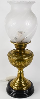 Lot 284 - An antique brass oil lamp, later converted to...