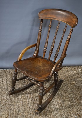 Lot 481 - A Victorian elm rocking chair of small...