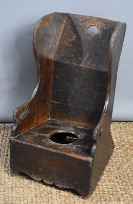 Lot 480 - A 19th century boarded oak child's commode chair.