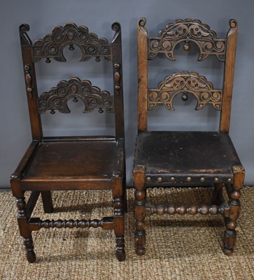 Lot 453 - Two 17th century style oak hall chairs with...