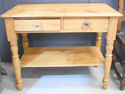 Lot 454 - An antique pine side table with two drawers...