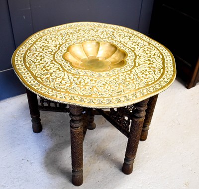 Lot 495 - A large antique Middle Eastern brass top table,...