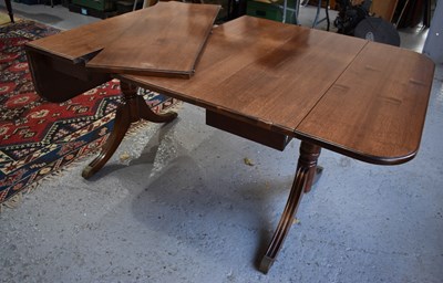 Lot 482 - A reproduction mahogany drop leaf dining table...