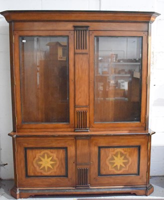 Lot 509 - A large hardwood display cabinet, the upper...