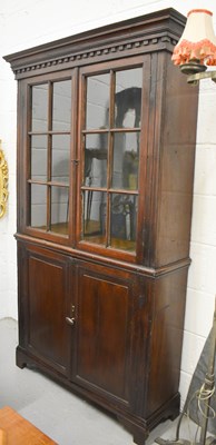 Lot 511 - A slim oak cabinet circa 1900, the upper...