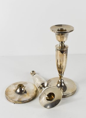 Lot 350 - A pair of silver candlesticks of simple...