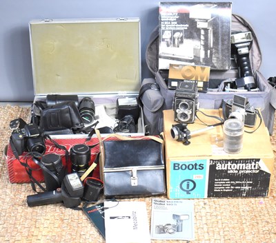 Lot 310 - An Olympus OM-2 35mm SLR Camera, together with...