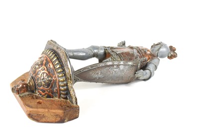 Lot 14 - A vintage metalware wall-mounted knight with a...