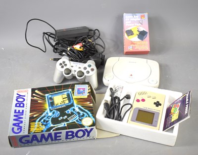 Lot 552 - A vintage Nintendo Game Boy with the original...