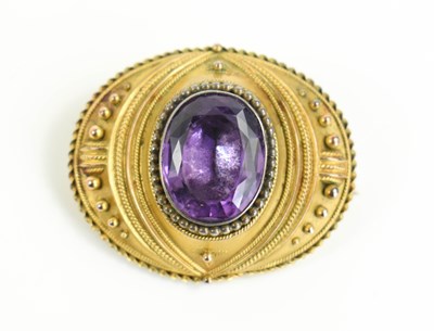 Lot 32 - A Victorian amethyst pinchbeck mourning brooch,...