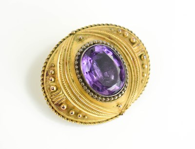 Lot 32 - A Victorian amethyst pinchbeck mourning brooch,...