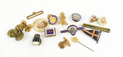Lot 161 - A gold plated stick pin with the ensignia of...