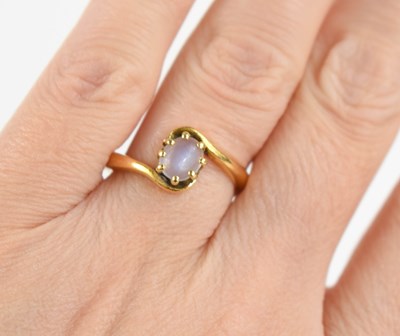 Lot 163 - A gold [tested as] and moonstone ring, the...