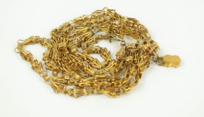 Lot 22 - A gold guard chain of intricate fancy links...