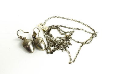 Lot 98 - A pair of unmarked silver acorn form pendant...