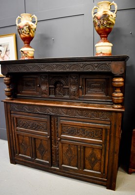 Lot 517 - A 17th century oak court cupboard, with cup...