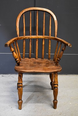 Lot 491 - A 19th century Child's Windsor armchair, with...