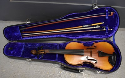 Lot 115 - A cased violin and two bows.