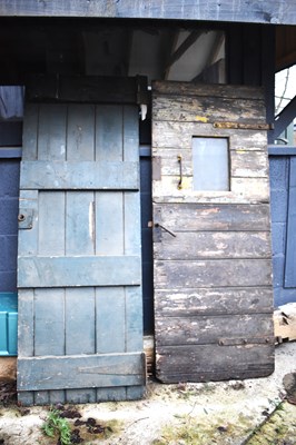 Lot 457 - Two large antique oak doors, one with a small...