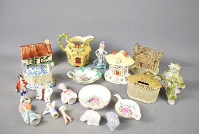 Lot 129 - A group of ceramic cottages and money boxes,...