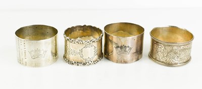 Lot 362 - A collection of four silver napkin rings, two...