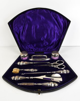 Lot 381 - An Edwardian silver cased vanity set,...