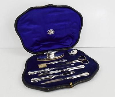 Lot 383 - A cased silver manicure set, by Goldsmiths &...