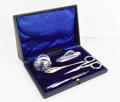 Lot 304 - A cased manicure set, consisting of jar and...