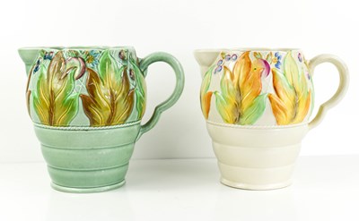 Lot 160 - A pair of Clarice Cliff jugs, with floral...
