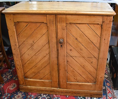 Lot 503 - An antique pine kitchen cupboard, the two...