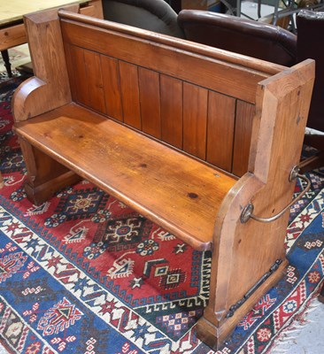 Lot 504 - An antique stained pine church pew of small...