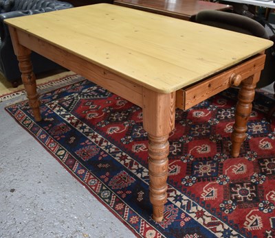 Lot 492 - A pine kitchen table with two drawers, turned...