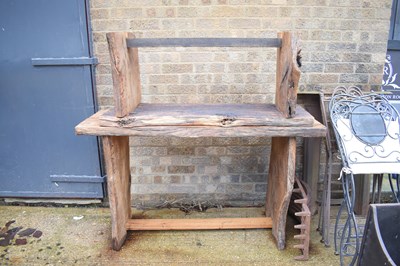 Lot 446 - An oak table and matching bench, in solid oak...