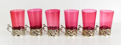 Lot 344 - A set of six cranberry glass and silver toddy...