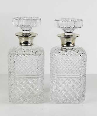 Lot 347 - A pair of silver and cut glass decanters, with...