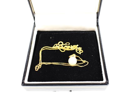 Lot 236 - A pearl and 9ct gold pendant with 9ct gold...