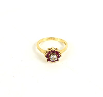 Lot 140 - A 9ct gold diamond and ruby ring, the central...