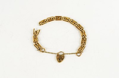 Lot 146 - A 9ct gold gate link charm bracelet, with...