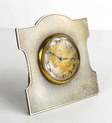 Lot 268 - An Art Deco silver table clock, with engine...