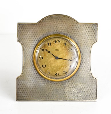 Lot 268 - An Art Deco silver table clock, with engine...