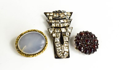 Lot 57 - An Art Deco French dress clip set with paste...