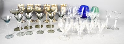 Lot 170 - Two spiral twist hand blown glasses, a set of...
