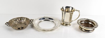 Lot 376 - A silver coaster with embossed rim and oak...