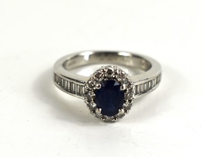 Lot 170 - A platinum, sapphire and diamond dress ring,...