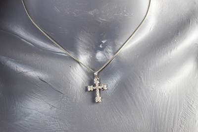 Lot 164 - An 18ct white gold and diamond set cross, of...