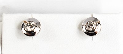 Lot 175 - A pair of 18ct white and diamond stud earrings,...