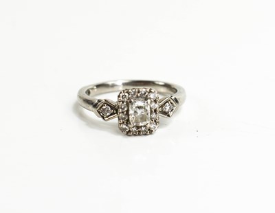 Lot 138 - A palladium and diamond ring, the central...