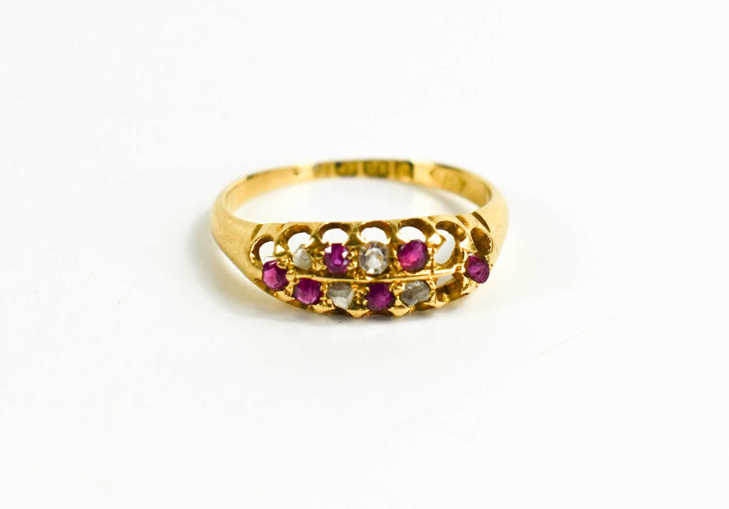 Lot 110 - An 18ct gold, pink sapphire and diamond ring,...